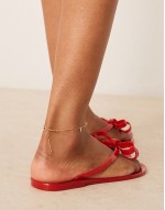 bow flip flops in red